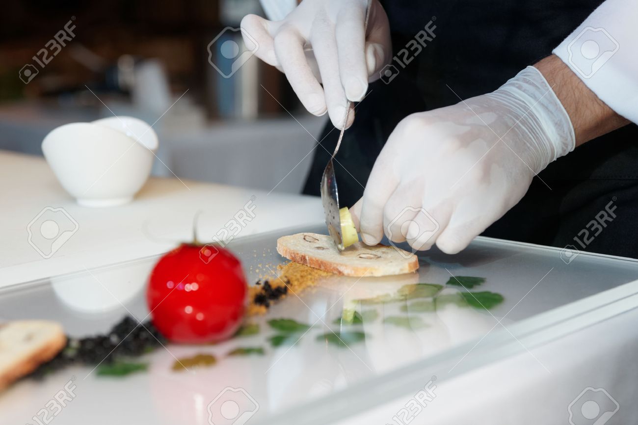 Chef is cooking an elegant gourmet dish - 34318217 Chef is cooking an elegant gourmet dish - 34318217