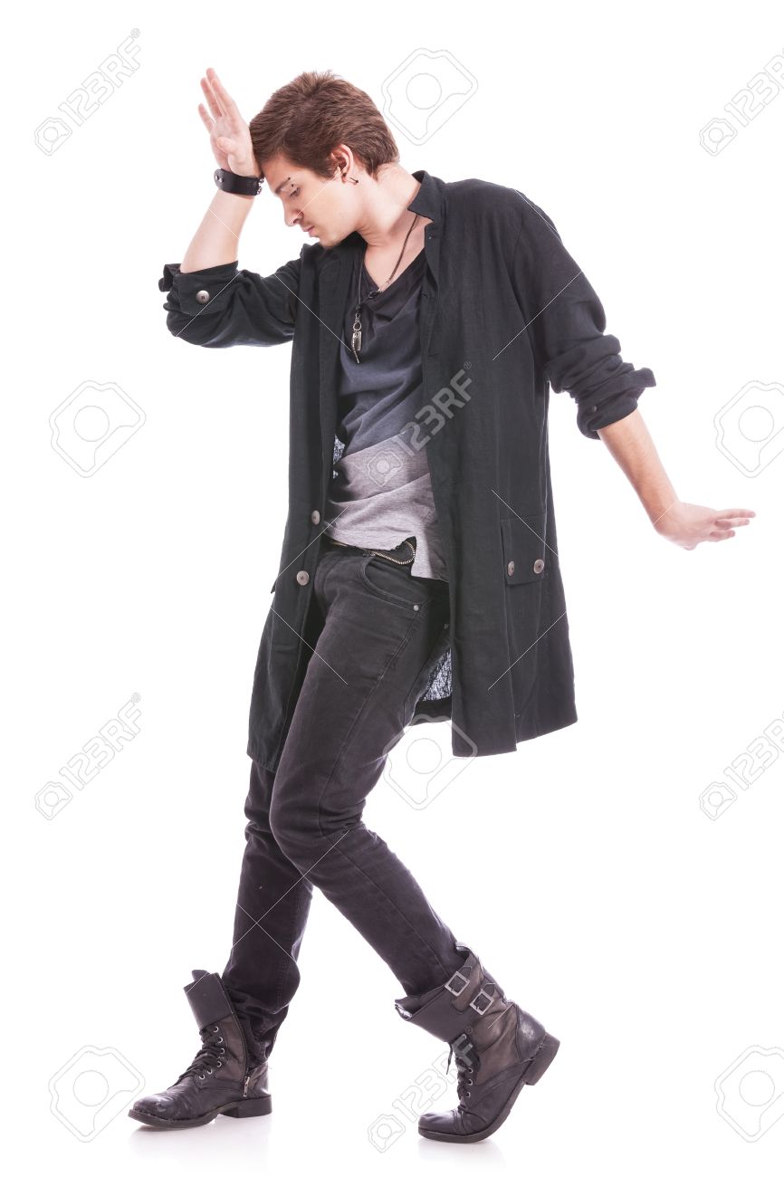 Full Length Picture Of A Casual Young Man Posing On The Floor With A Smile  On His Face And A Hand At His Head. On A White Background Stock Photo,  Picture and