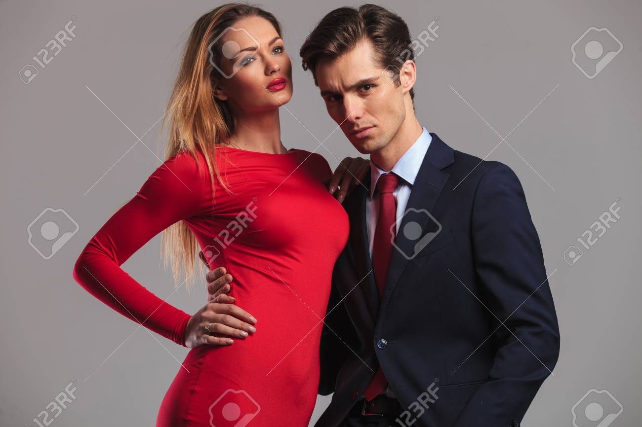 Elegant Couple Standing Embraced, Woman