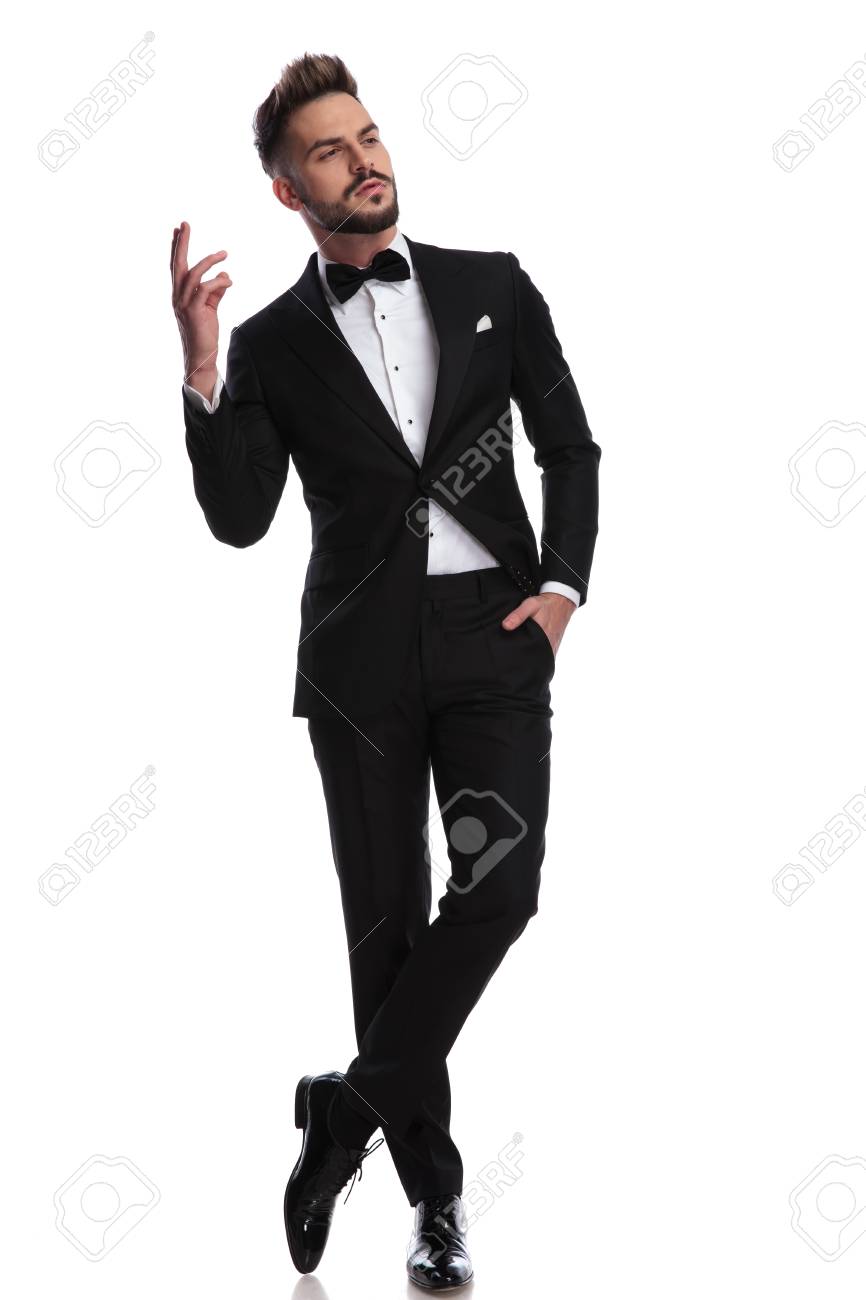 arrogant man in tuxedo is gesturing while standing on white background stock photo picture and royalty free image image 95311500 arrogant man in tuxedo is gesturing while standing on white background