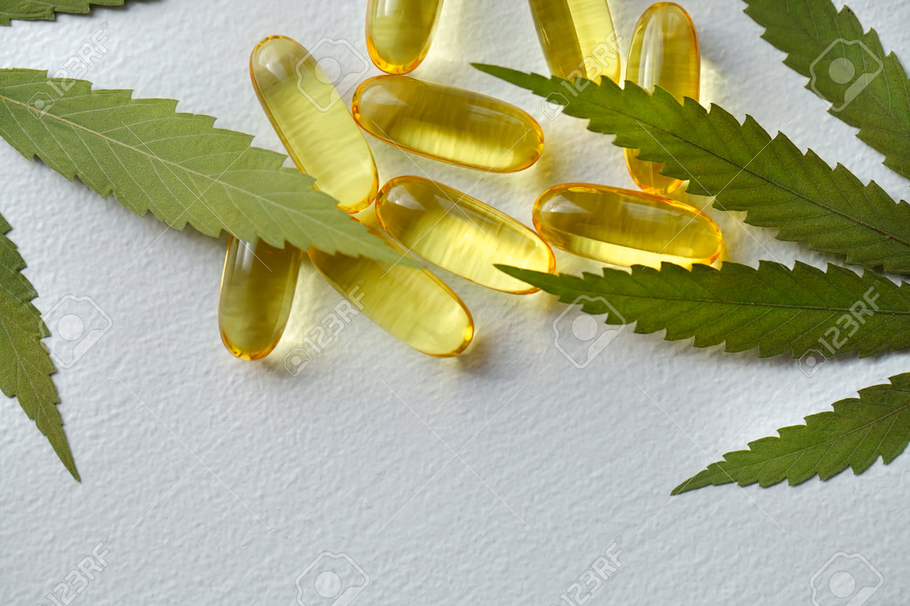 Medical cannabis products, leaf, capsules and CBD oil on white background. Pharmaceutical gelatin softgels with biological plant herbal. Organic dietary supplements concept - 169732012 Medical cannabis products, leaf, capsules and CBD oil on white background. Pharmaceutical gelatin softgels with biological plant herbal. Organic dietary supplements concept - 169732012
