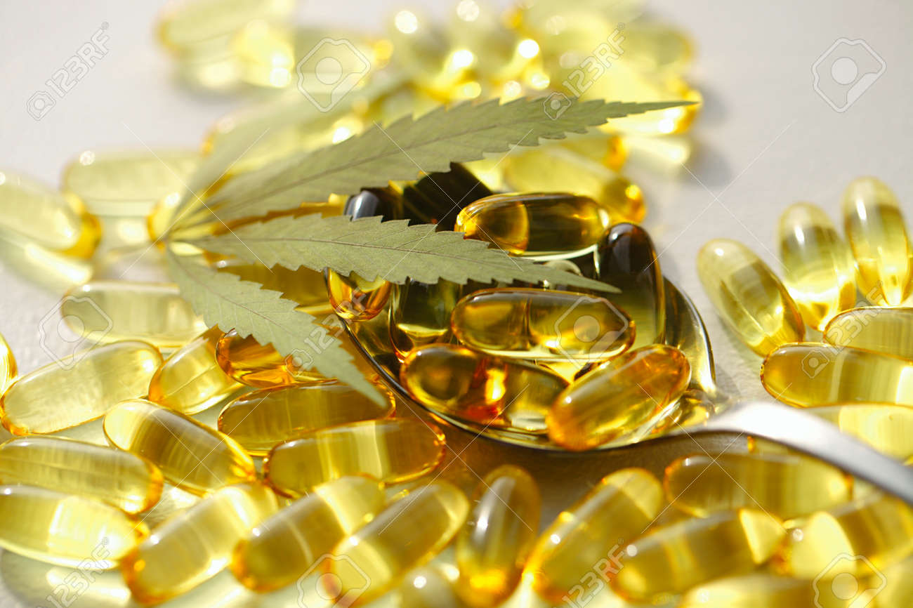 Medical cannabis products, leaf, capsules and CBD oil on white background. Pharmaceutical gelatin softgels with biological plant herbal. Organic dietary supplements concept - 169732026 Medical cannabis products, leaf, capsules and CBD oil on white background. Pharmaceutical gelatin softgels with biological plant herbal. Organic dietary supplements concept - 169732026