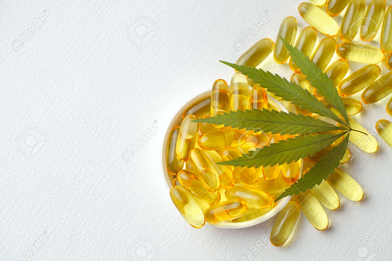 Medical cannabis products, leaf, capsules and CBD oil on white background. Pharmaceutical gelatin softgels with biological plant herbal. Organic dietary supplements concept - 169732308 Medical cannabis products, leaf, capsules and CBD oil on white background. Pharmaceutical gelatin softgels with biological plant herbal. Organic dietary supplements concept - 169732308