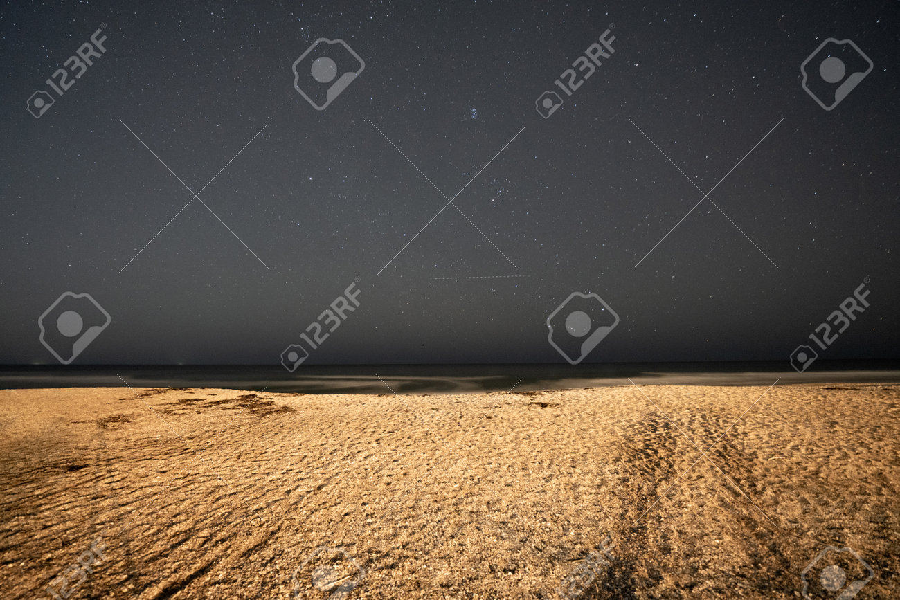 Night stars over the beach sand - 161260345 Night stars over the beach sand - 161260345