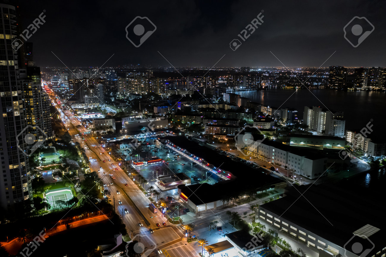 Shopping plaza strip mall night aerial photo - 161711315 Shopping plaza strip mall night aerial photo - 161711315