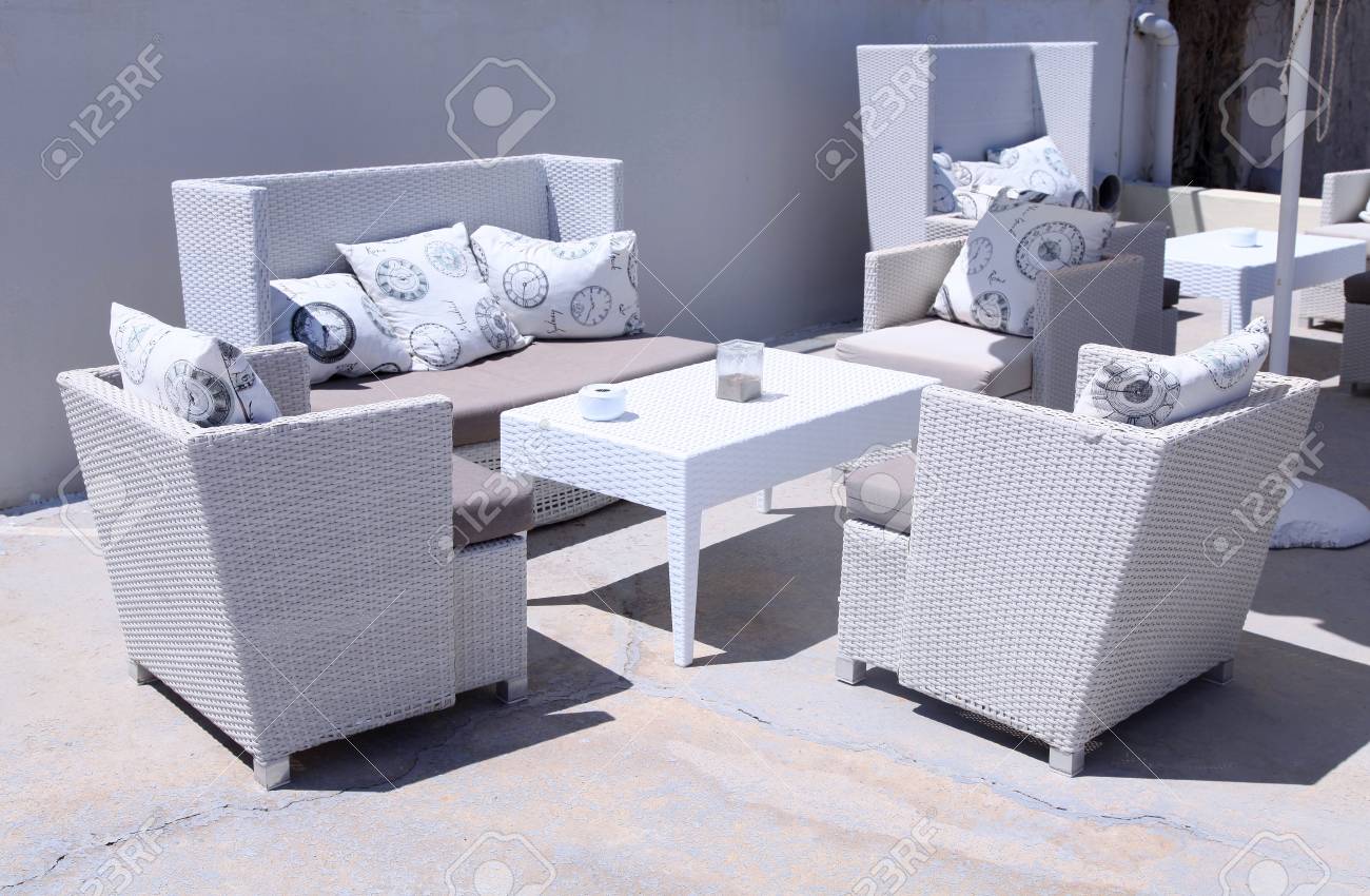 White Outdoor Furniture Rattan Armchairs On Resort Terrace Greece