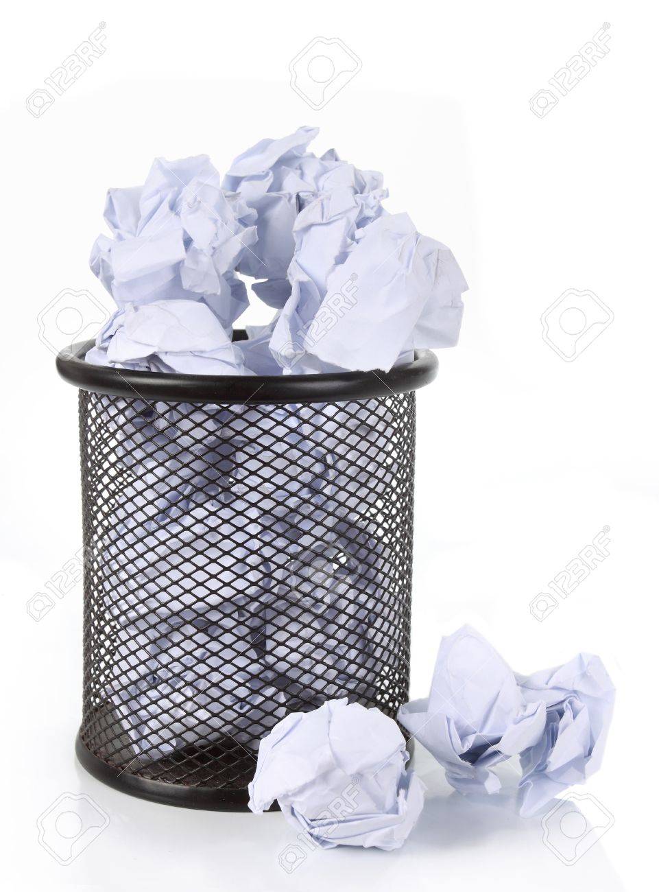 Full Wire Mesh Trash Can With Crumpled Paper Scattered Around. Isolated On  White Stock Photo, Picture and Royalty Free Image. Image 10314021.