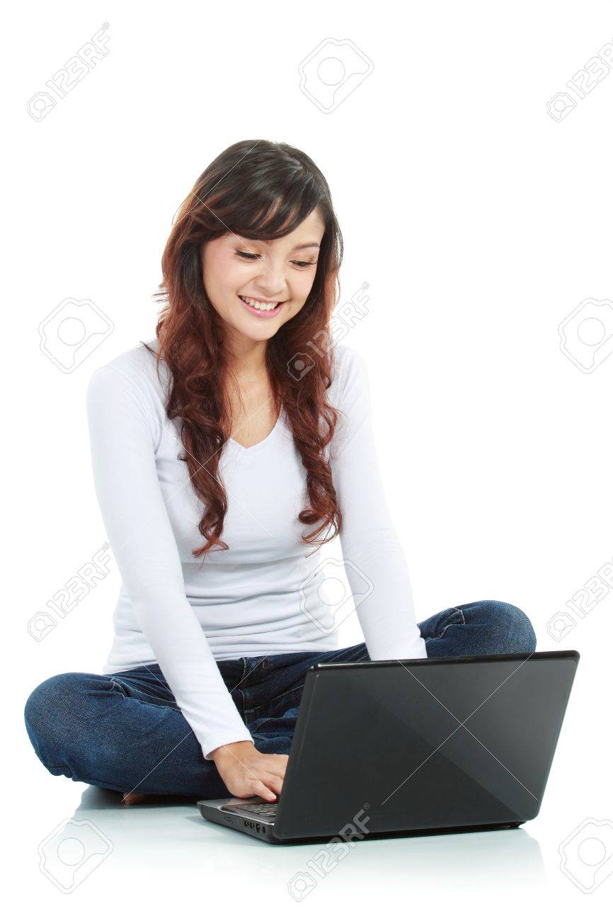 Young female sitting cross-legged on floor with laptop isolated white background - 11844916 Young female sitting cross-legged on floor with laptop isolated white background - 11844916