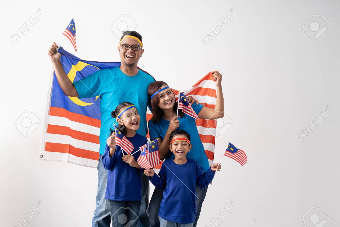 malaysian family holding malaysia flag over white background - 128978824 malaysian family holding malaysia flag over white background - 128978824