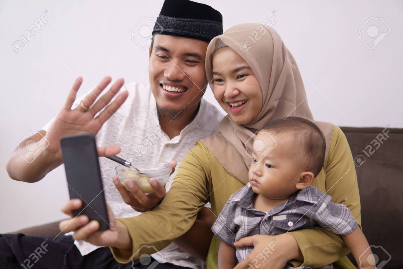 family muslim make a video call with family - 146095882 family muslim make a video call with family - 146095882