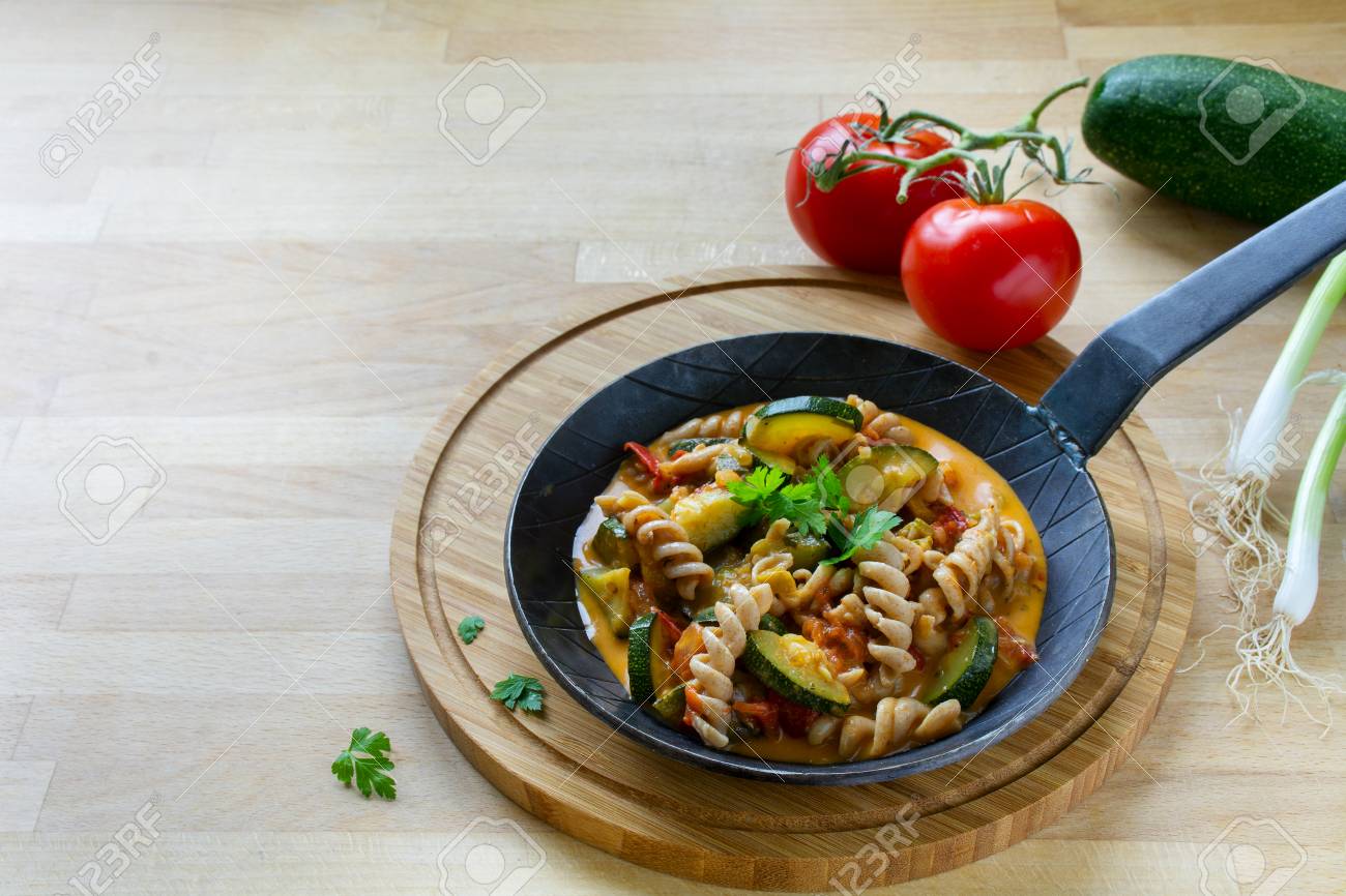 Wholemeal Pasta With Zucchini And Tomato Vegetables In A Small ... Wholemeal Pasta With Zucchini And Tomato Vegetables In A Small ...