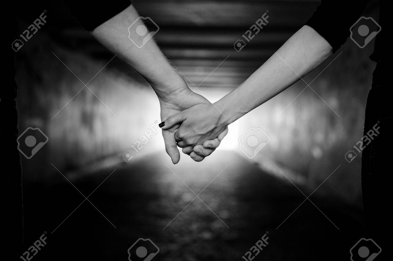 Couple holding hands grayscale romantic