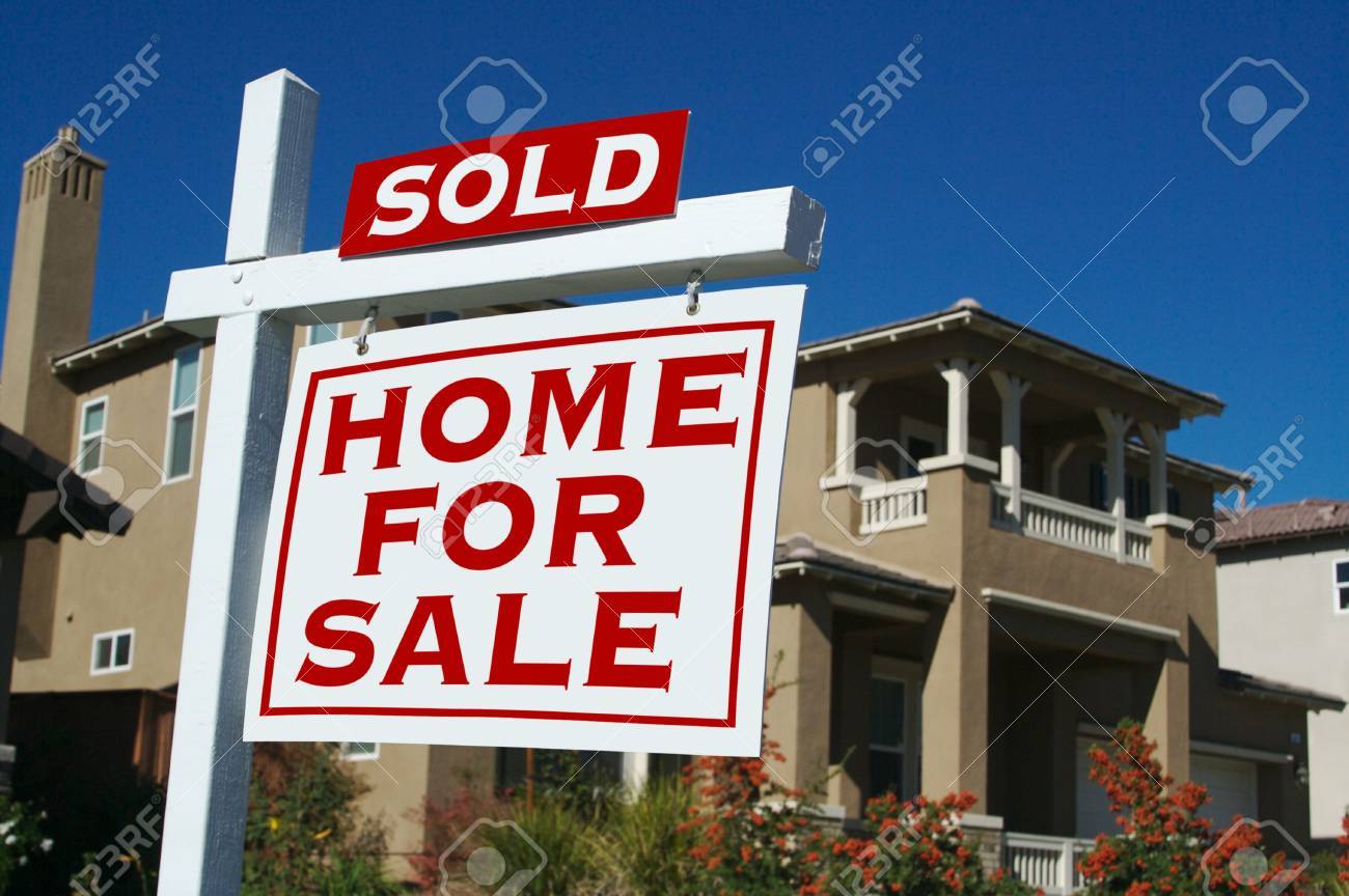 sold home for sale sign and new house on a deep blue sky for sale sign sold