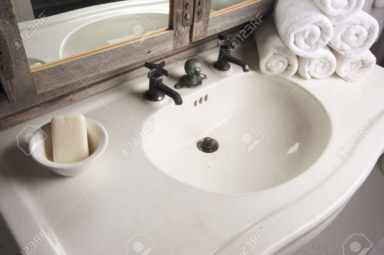 Bathroom Sink And Mirror rustic bathroom sink and mirror stock photo, picture and royalty Bathroom Sink And Mirror rustic bathroom sink and mirror stock photo, picture and royalty