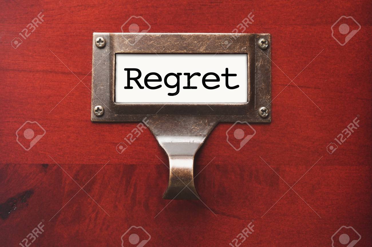 Lustrous Wooden Cabinet with Regret File Label in Dramatic LIght. - 12837778 Lustrous Wooden Cabinet with Regret File Label in Dramatic LIght. - 12837778