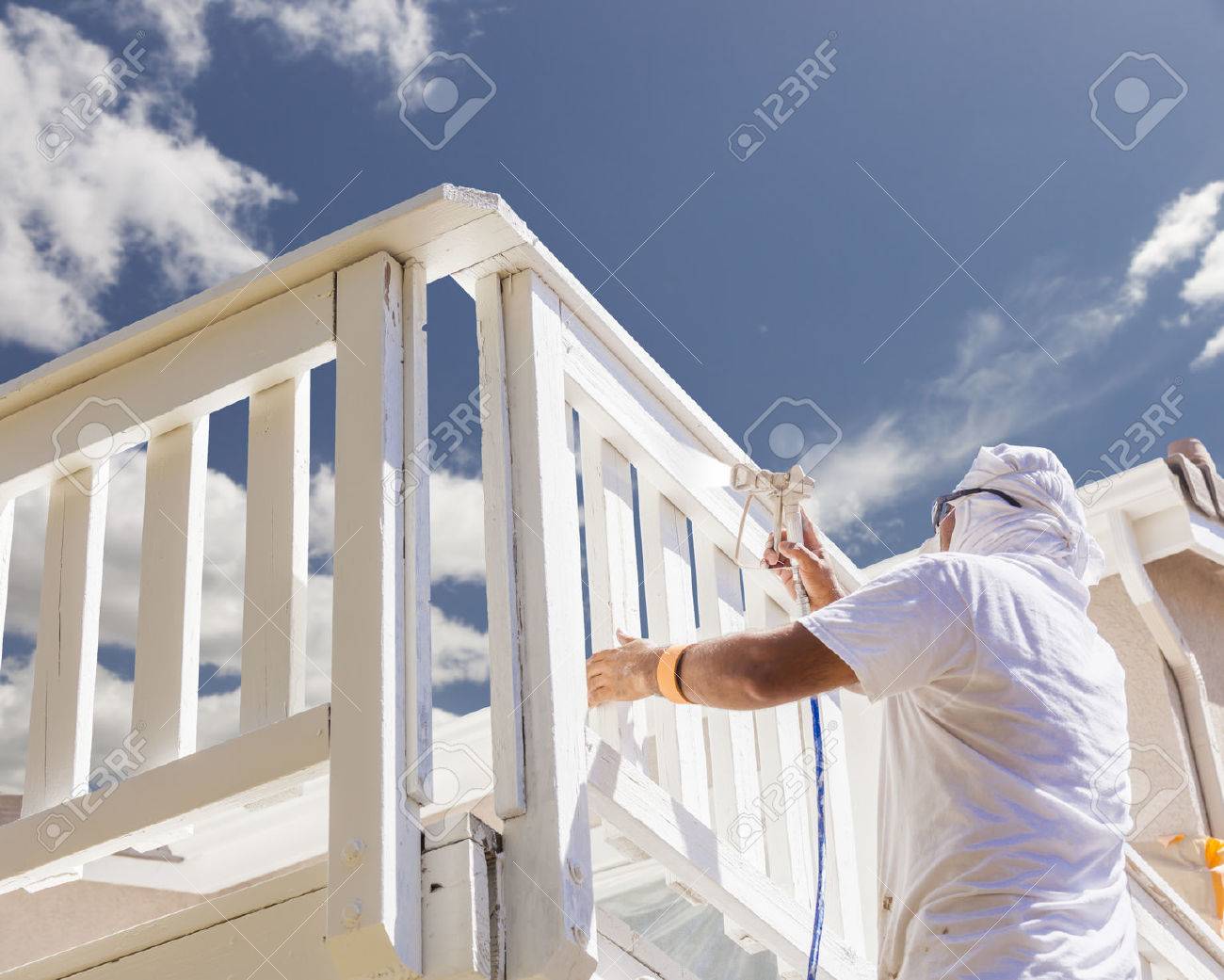 House Painter Wearing Facial Protection Spray Painting A Deck Stock Photo Picture And Royalty Free Image Image 38434664