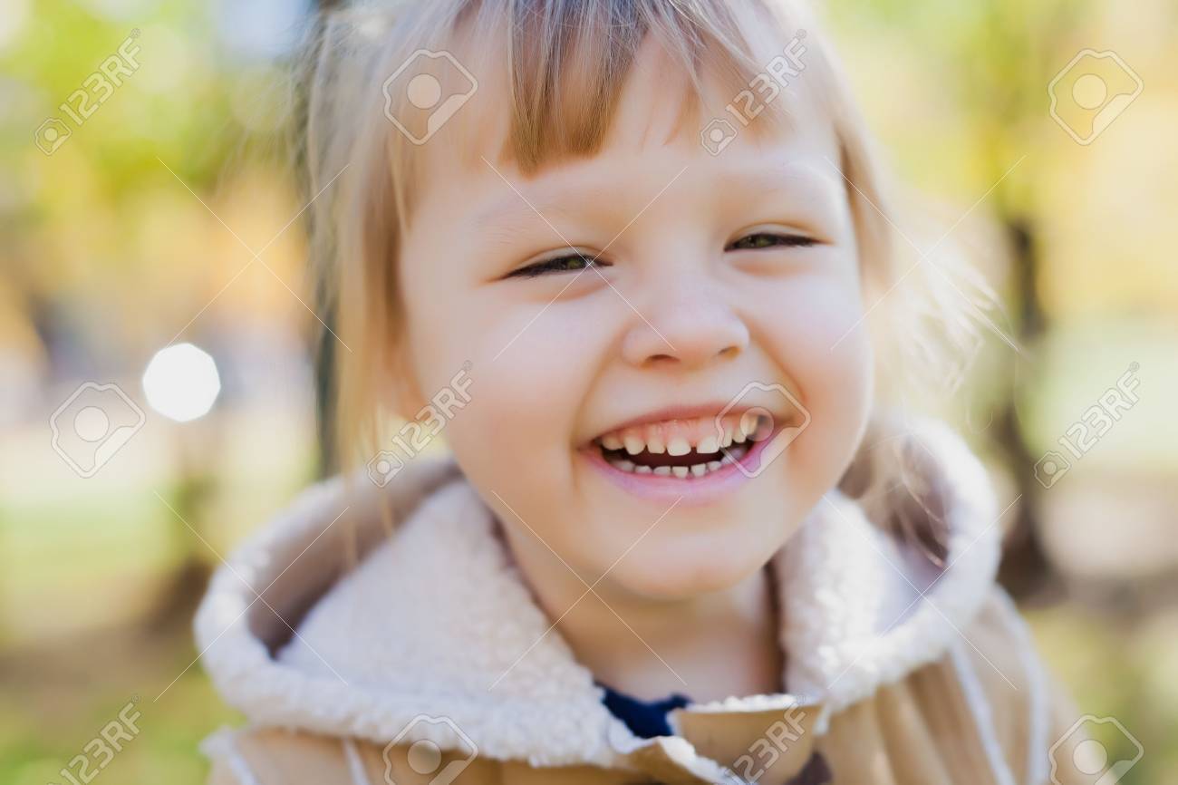 Laughing Face Of Baby Girl Stock Photo, Picture and Royalty Free Image.  Image 33829797.