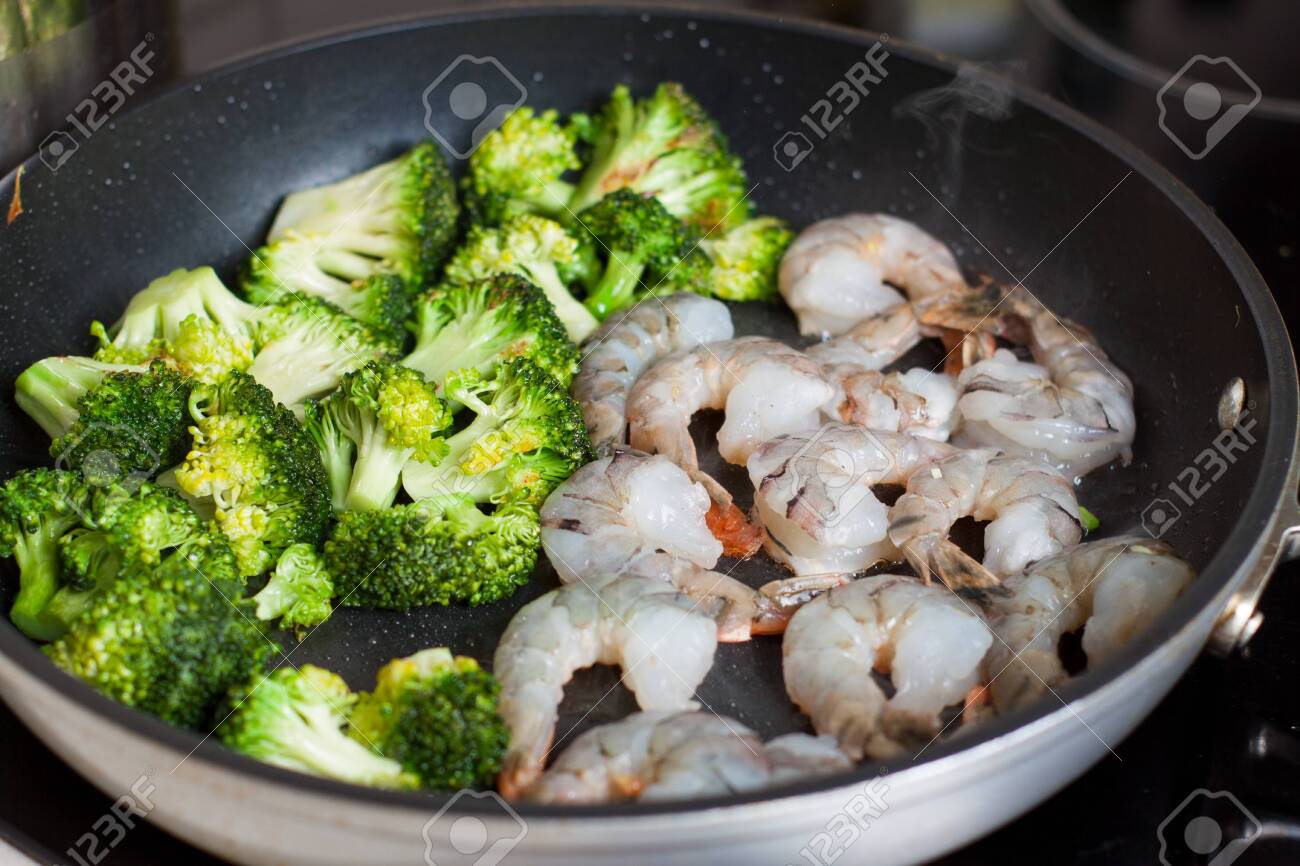 Preparation Of Shrimps With Broccoli And Honey And Garlic Sauce Stock Photo Picture And Royalty Free Image Image 113953458