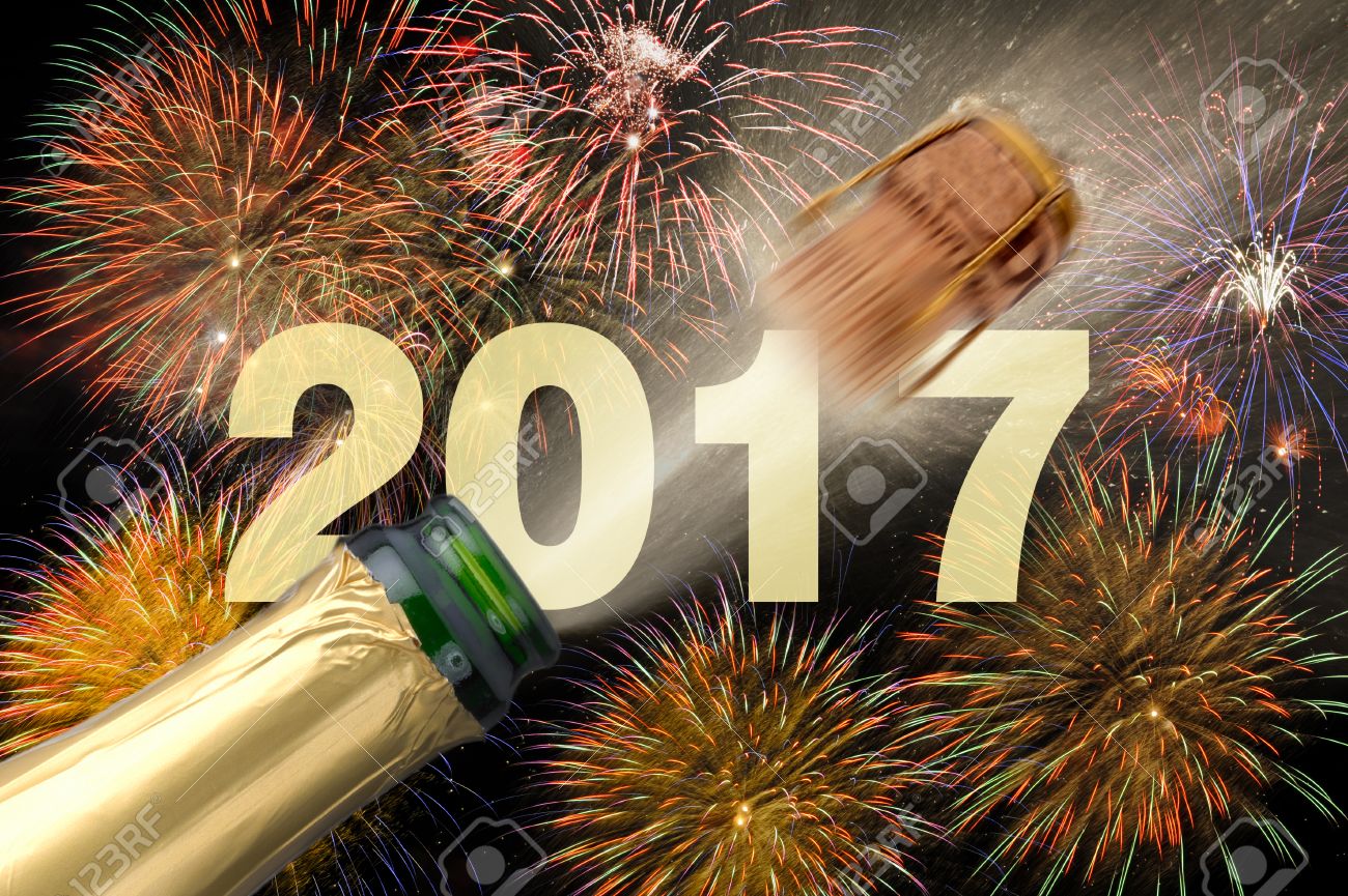 popping champagne and fireworks at new years eve 2017 - 60721056 popping champagne and fireworks at new years eve 2017 - 60721056