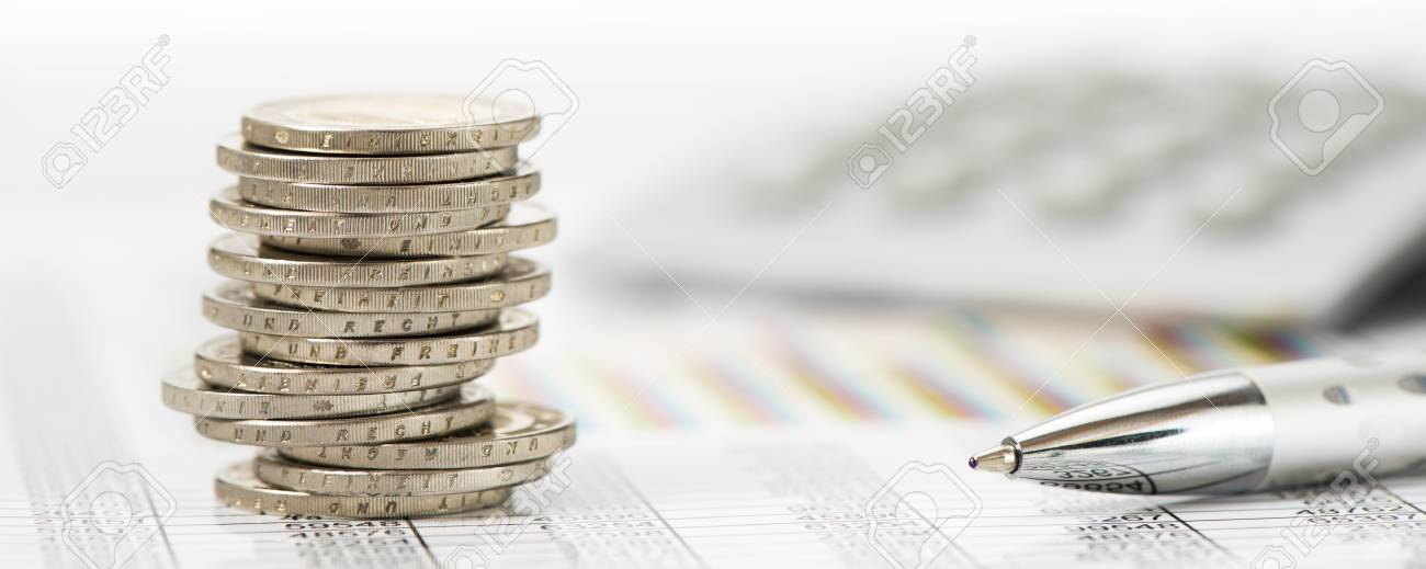 stacked coins over data of stock market with calculator - 80698492 stacked coins over data of stock market with calculator - 80698492