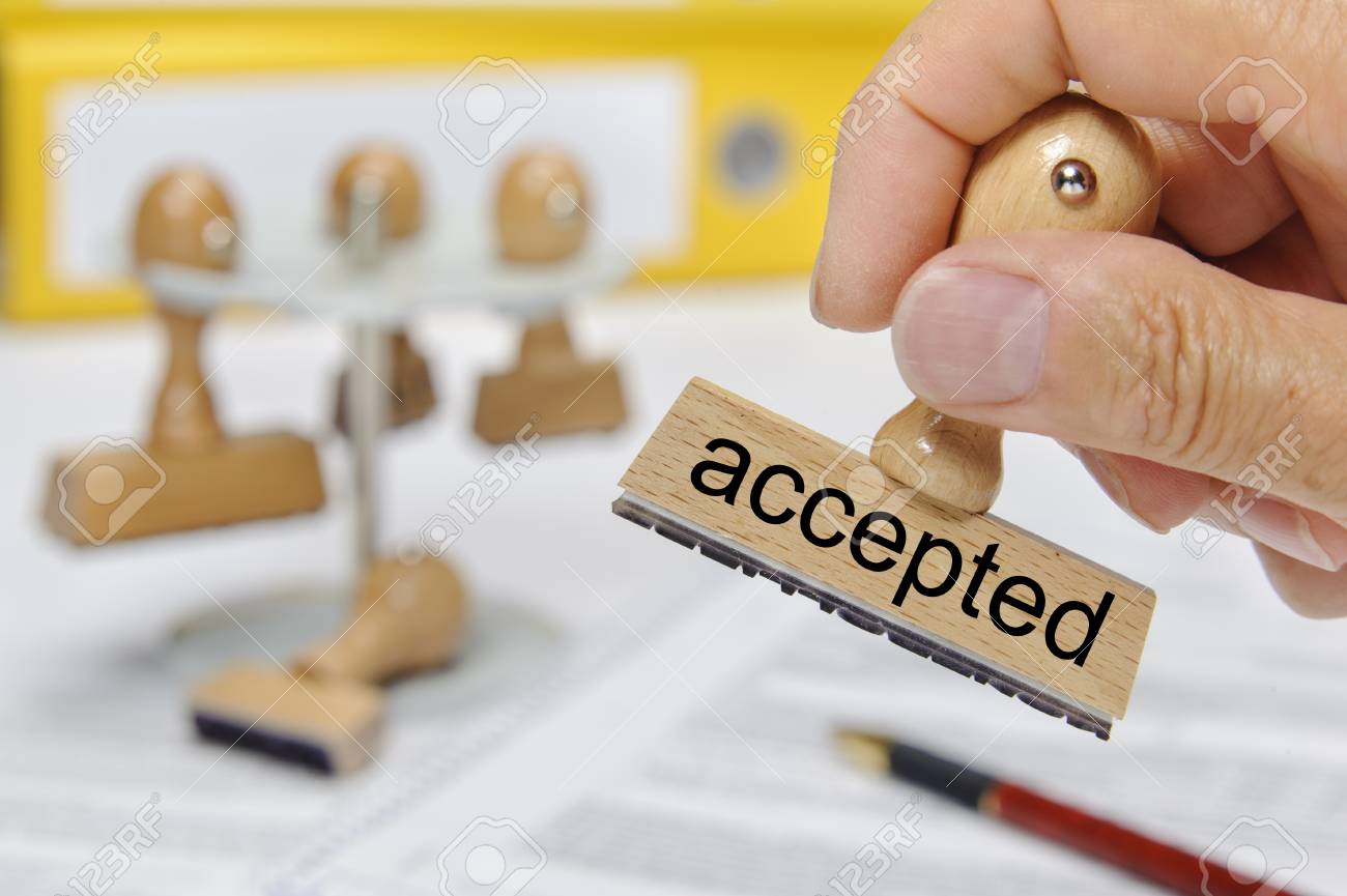 accepted printed on rubber stamp holding in hand - 97760411 accepted printed on rubber stamp holding in hand - 97760411