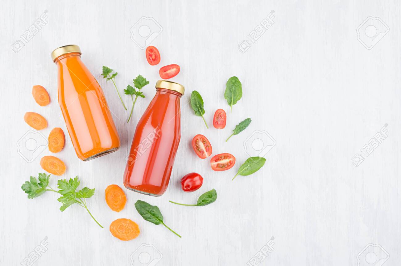 Download Organic Tomato And Carrot Juices In Glass Bottles With Ingredients Stock Photo Picture And Royalty Free Image Image 149650700