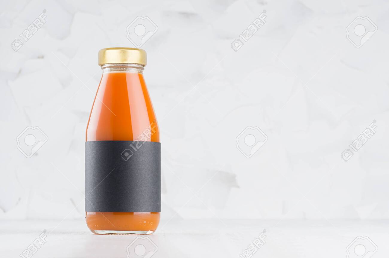 Download Carrot Juice In Glass Bottle With Gold Cap And Black Blank Label Stock Photo Picture And Royalty Free Image Image 154524716