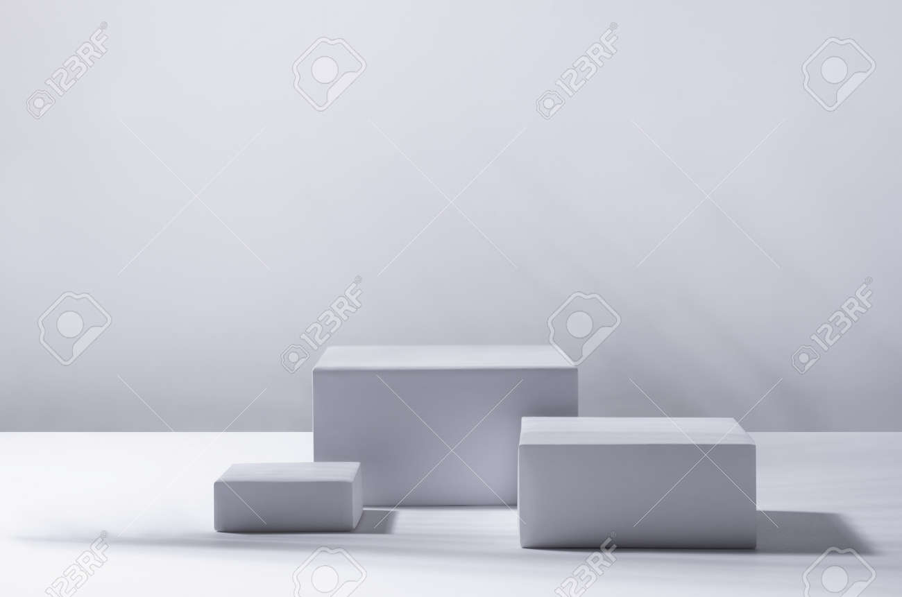 Elegant modern tropical style of showcase for cosmetics product display - white podiums as winner in sunlight with shadow palm foliage in white background. - 168468845 Elegant modern tropical style of showcase for cosmetics product display - white podiums as winner in sunlight with shadow palm foliage in white background. - 168468845