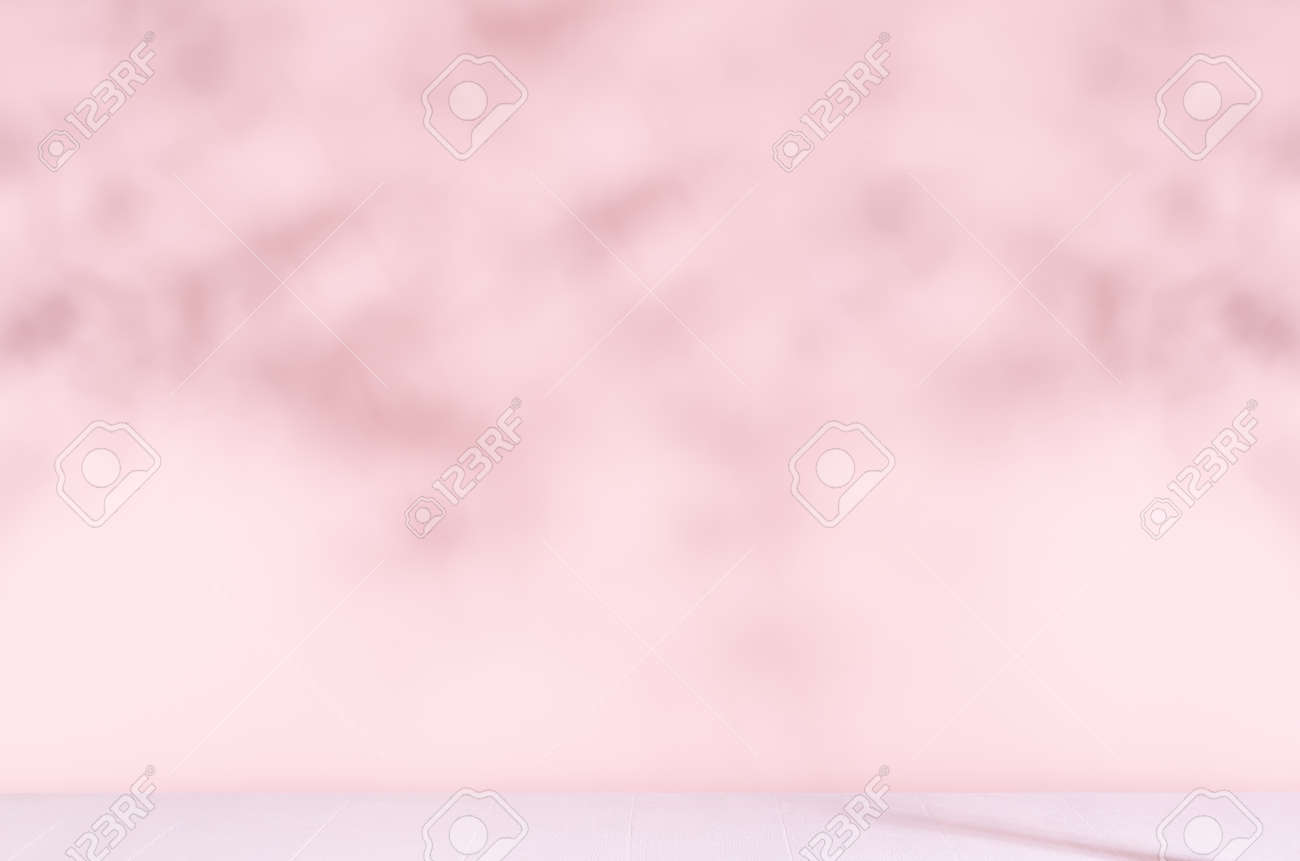 Pastel pink wall with blur shadow of leaves in sunny day with white wood table or floor. Fresh delicate summer background. - 168468894 Pastel pink wall with blur shadow of leaves in sunny day with white wood table or floor. Fresh delicate summer background. - 168468894