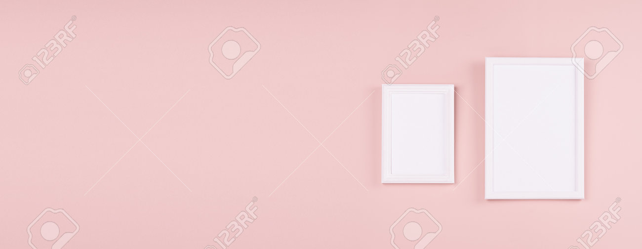 Elegant contemporary gallery in simple style with two black rectangle photo frame hanging on soft light pastel pink wall with copy space, web banner. - 168468966 Elegant contemporary gallery in simple style with two black rectangle photo frame hanging on soft light pastel pink wall with copy space, web banner. - 168468966