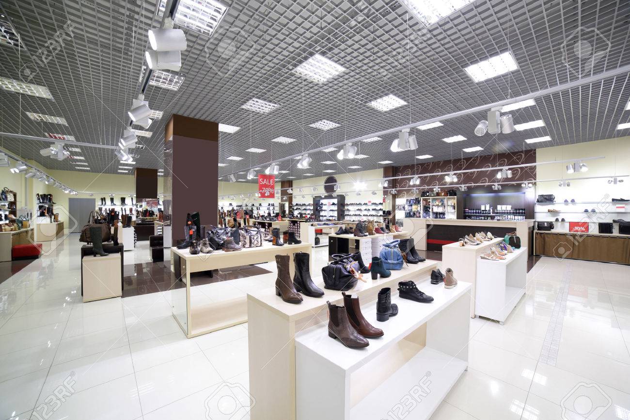bright and fashionable interior of shoe store in modern mall - 34298874 bright and fashionable interior of shoe store in modern mall - 34298874