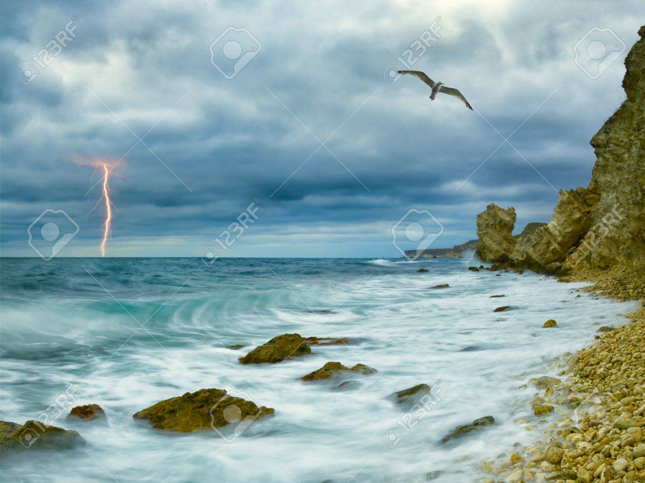 Seagull Over Ocean Comes Nearer A Thunder Storm Towards The Coast From Rocks And Seagull Over Ocean Comes Nearer A Thunder Storm Towards The Coast From Rocks And