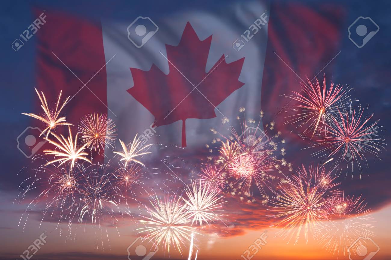 holiday sky with fireworks and flag of canada independence day fireworks and flag