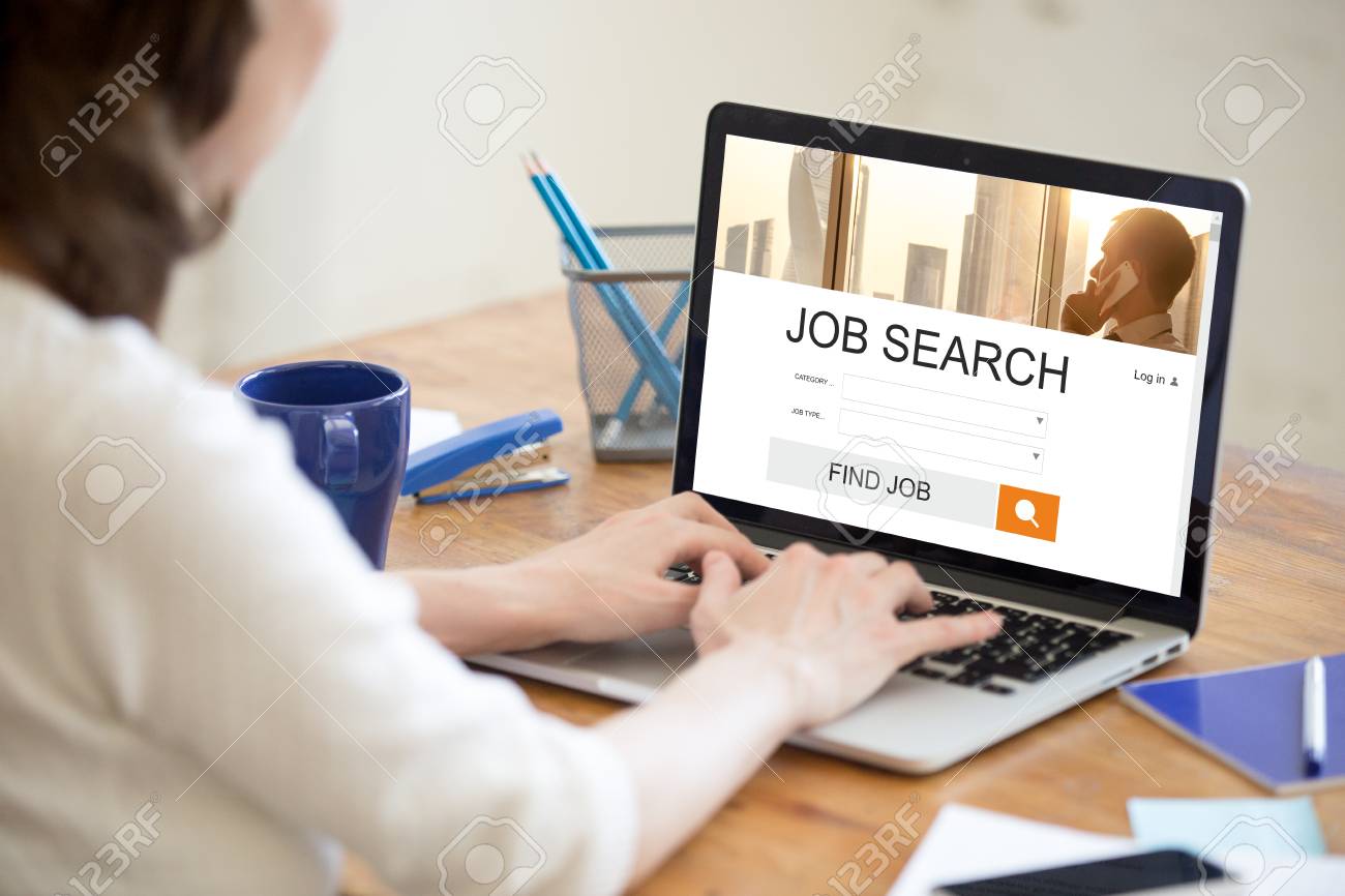 young business woman working in office interior searching for find jobs online