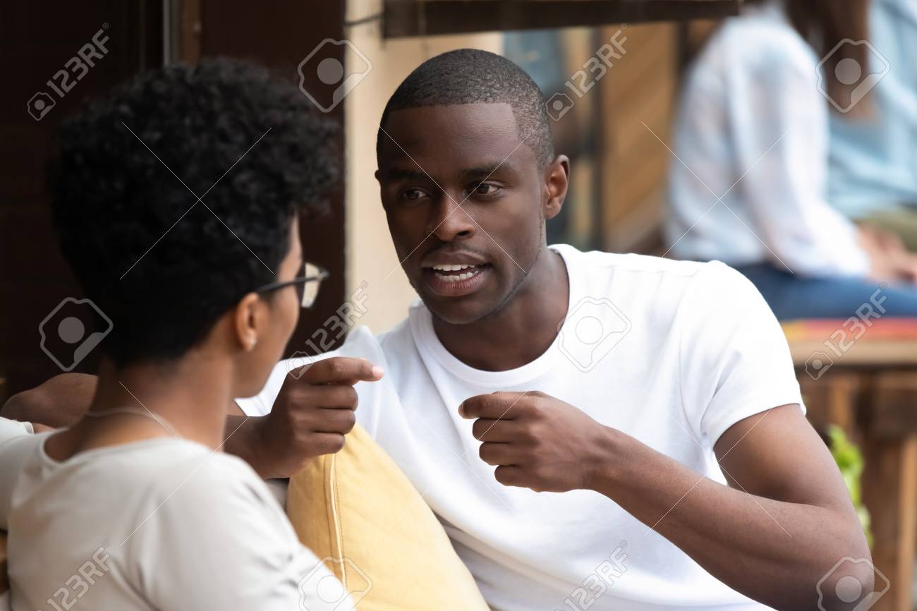 Black Attractive Guy Talking With Beloved Mixed Race Girl Millennial Married Couple Spending Time Together Talking Resting In Cozy Summer Cafe Friends Chatting Relaxing In Public Place Stock Photo Picture And Royalty