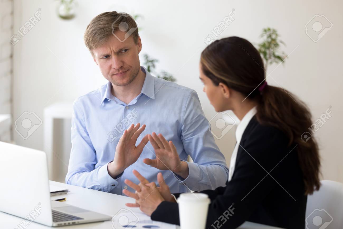 Funny businessman rejecting to give interview to journalist. Stop sign. Man from recruitment management stopping interviewing lady, fraud, unhappy customer complaining, demanding compensation - 121256586 Funny businessman rejecting to give interview to journalist. Stop sign. Man from recruitment management stopping interviewing lady, fraud, unhappy customer complaining, demanding compensation - 121256586