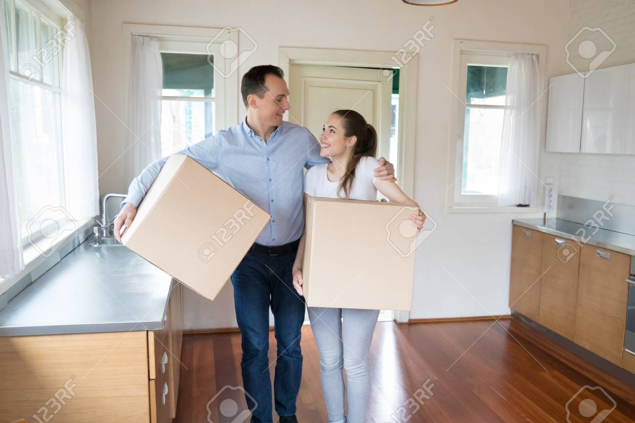 Happy Married Couple Moving To New House Excited Husband And Stock Photo Picture And Royalty Free Image Image 121256824