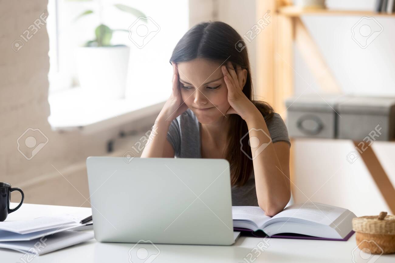 Unmotivated Female Student Sit At Desk Distracted Form Computer Stock Photo Picture And Royalty Free Image Image 129610469