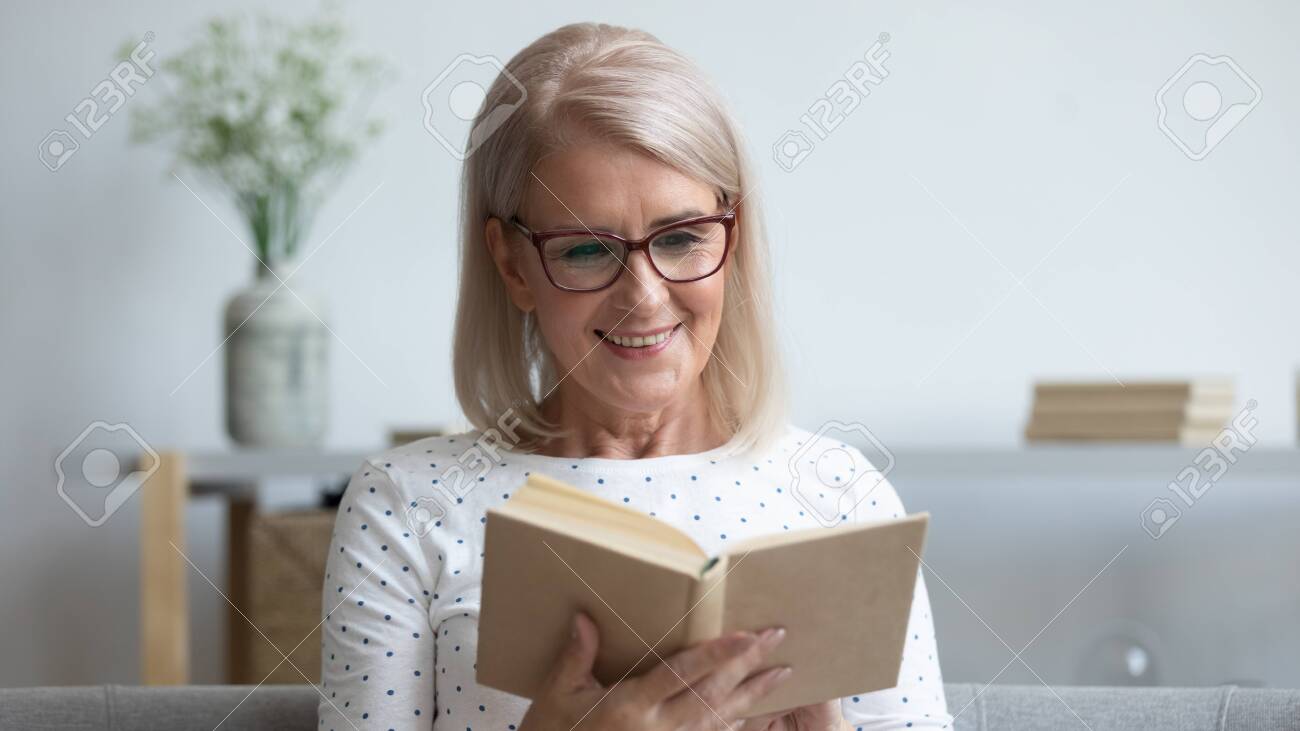 https://previews.123rf.com/images/fizkes/fizkes1912/fizkes191200236/134588074-horizontal-image-elderly-woman-in-glasses-sitting-on-sofa-reading-new-interesting-book-pastime-and.jpg