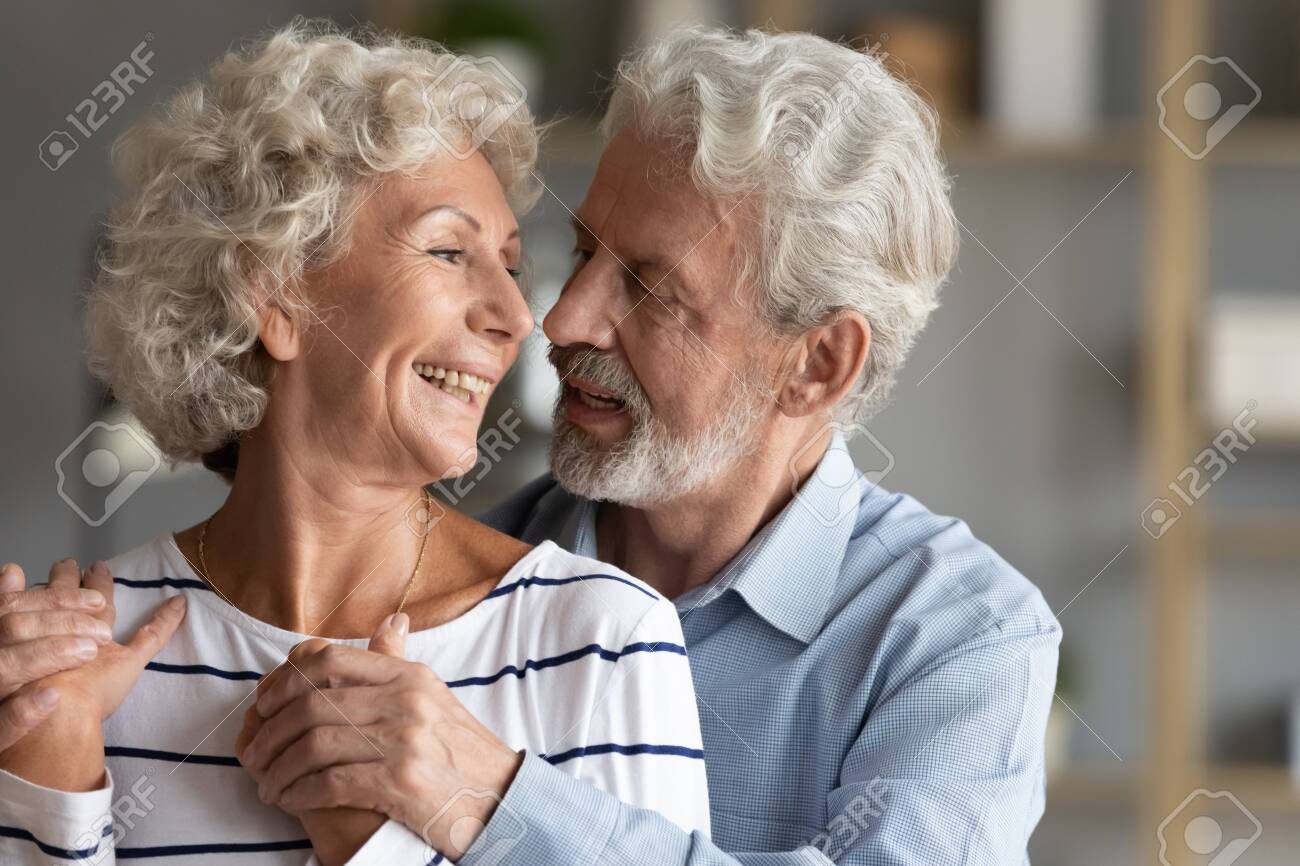 Smiling Mature 60s Couple Spouses