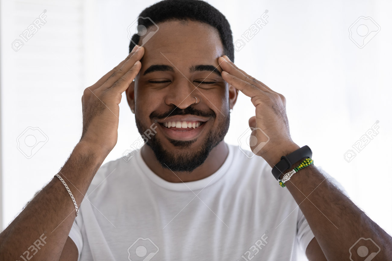 Head Shot Happy Mixed Race African Man Doing Relaxing Facial Massage,  Enjoying Morning Beauty Anti-wrinkles Procedure, Isolated On White  Background, Feeling Energetic Involved In Skincare Routine. Stock Photo,  Picture and Royalty Free, image size:1300x867