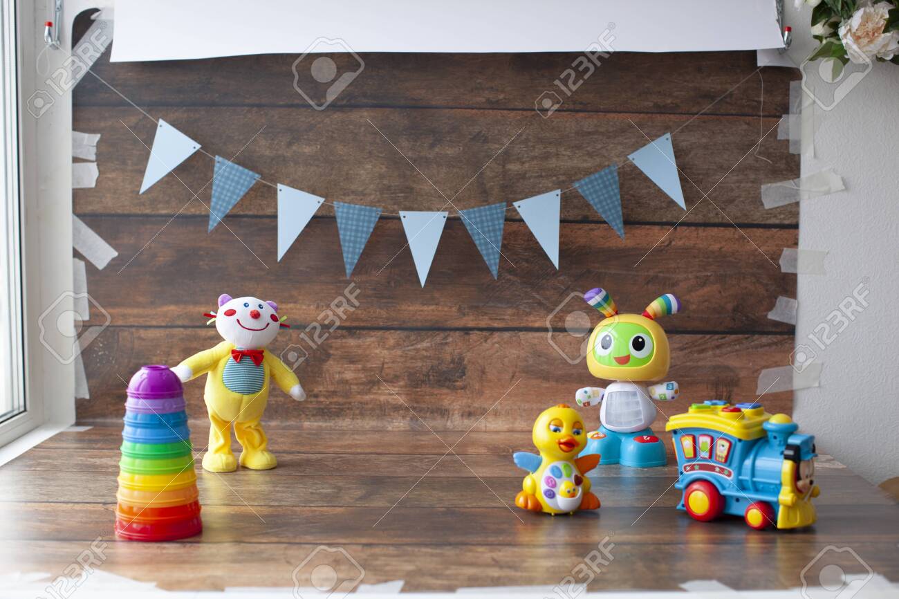 Background For One Year Old Baby Photo Shoot Paper Garland On Wooden Backdrop With Toys For Little Boys And Girls Stock Photo Picture And Royalty Free Image Image