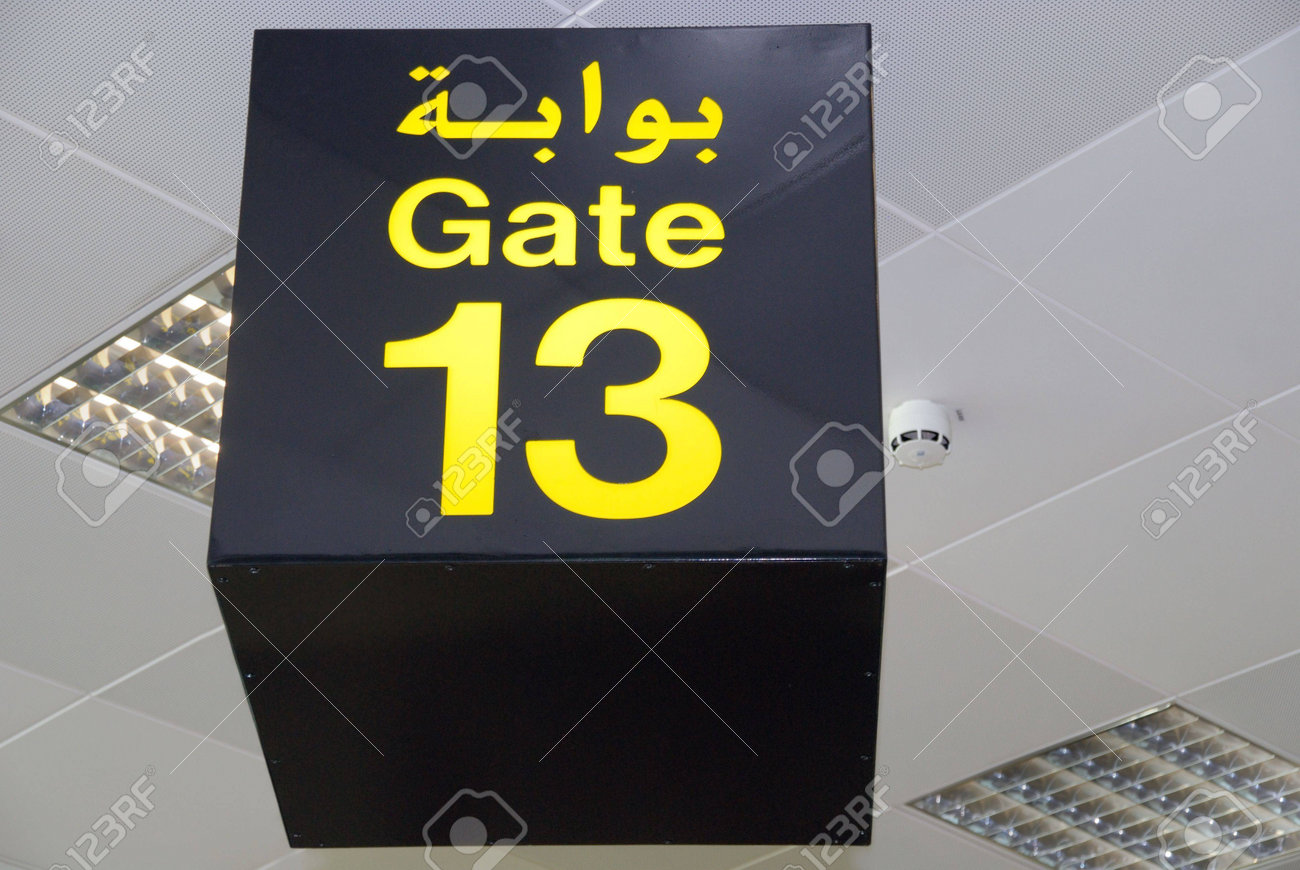 Ceiling Sign Of Gate 13 Thirteen In Arabic And English In An