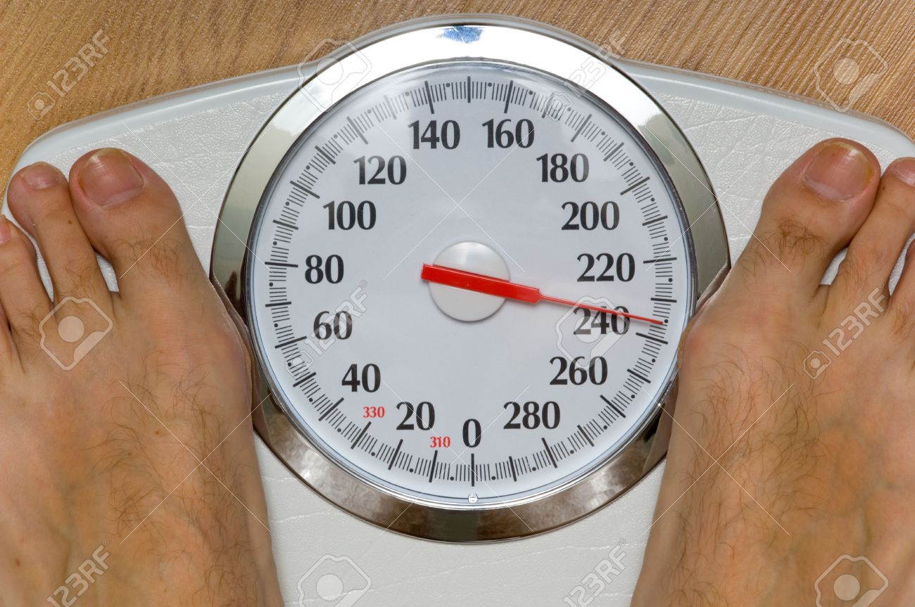 Heavy Man On Scale With Large Dial Weighing 230 Pounds Theme Stock Photo Picture And Royalty Free Image Image