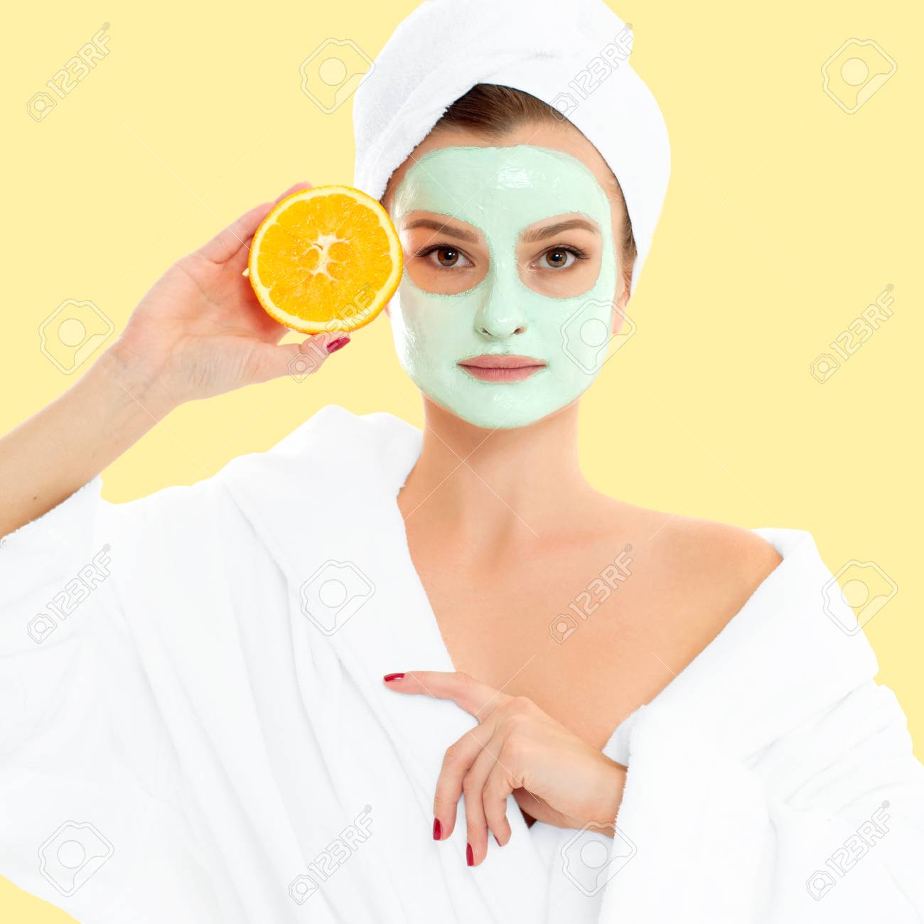 Download Beautiful Woman Is Getting Facial Clay Mask On Pastel Yellow Stock Photo Picture And Royalty Free Image Image 94499812 PSD Mockup Templates