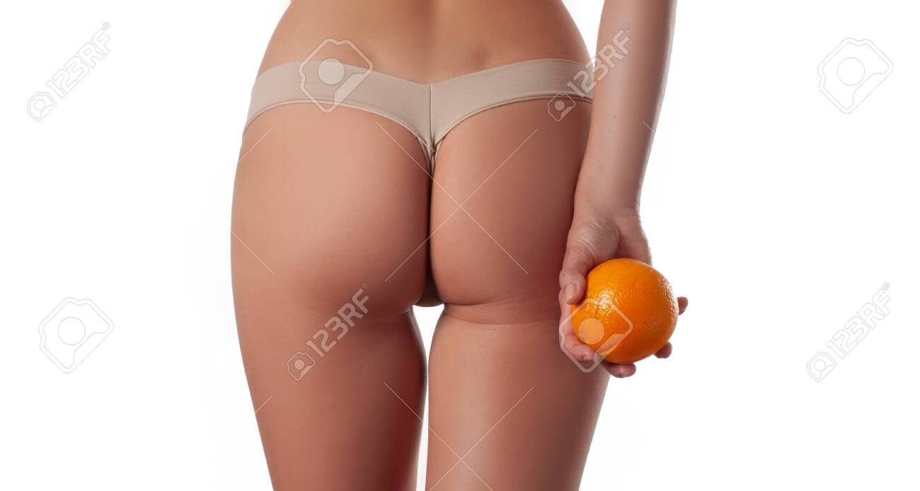 Slim Woman Is Holding Orange. Perfect Female Buttocks Without Cellulite.  Beautiful Woman's Butt In Underwear. Body Care And Anti Cellulite Massage  Stock Photo, Picture and Royalty Free Image. Image 124369356.