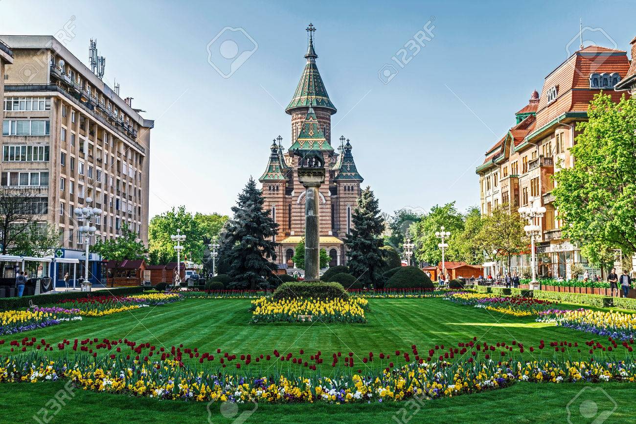 TIMISOARA, ROMANIA - APRIL 15, 2016: Floral arrangements in Victory Square, with orthodox cathedral in background. - 57927749 TIMISOARA, ROMANIA - APRIL 15, 2016: Floral arrangements in Victory Square, with orthodox cathedral in background. - 57927749