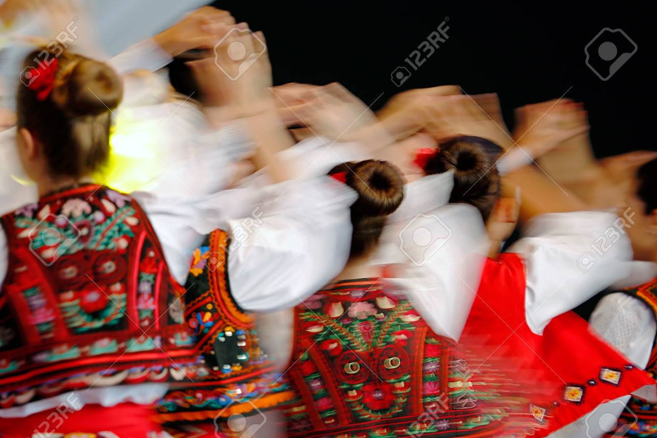 Abstract blur moving with amazing dance. Young Romanian dancers in traditional costume. - 61942122 Abstract blur moving with amazing dance. Young Romanian dancers in traditional costume. - 61942122