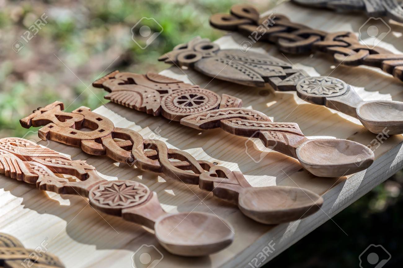Decorative wooden spoons carved with traditional Romanian patterns. - 88268486 Decorative wooden spoons carved with traditional Romanian patterns. - 88268486