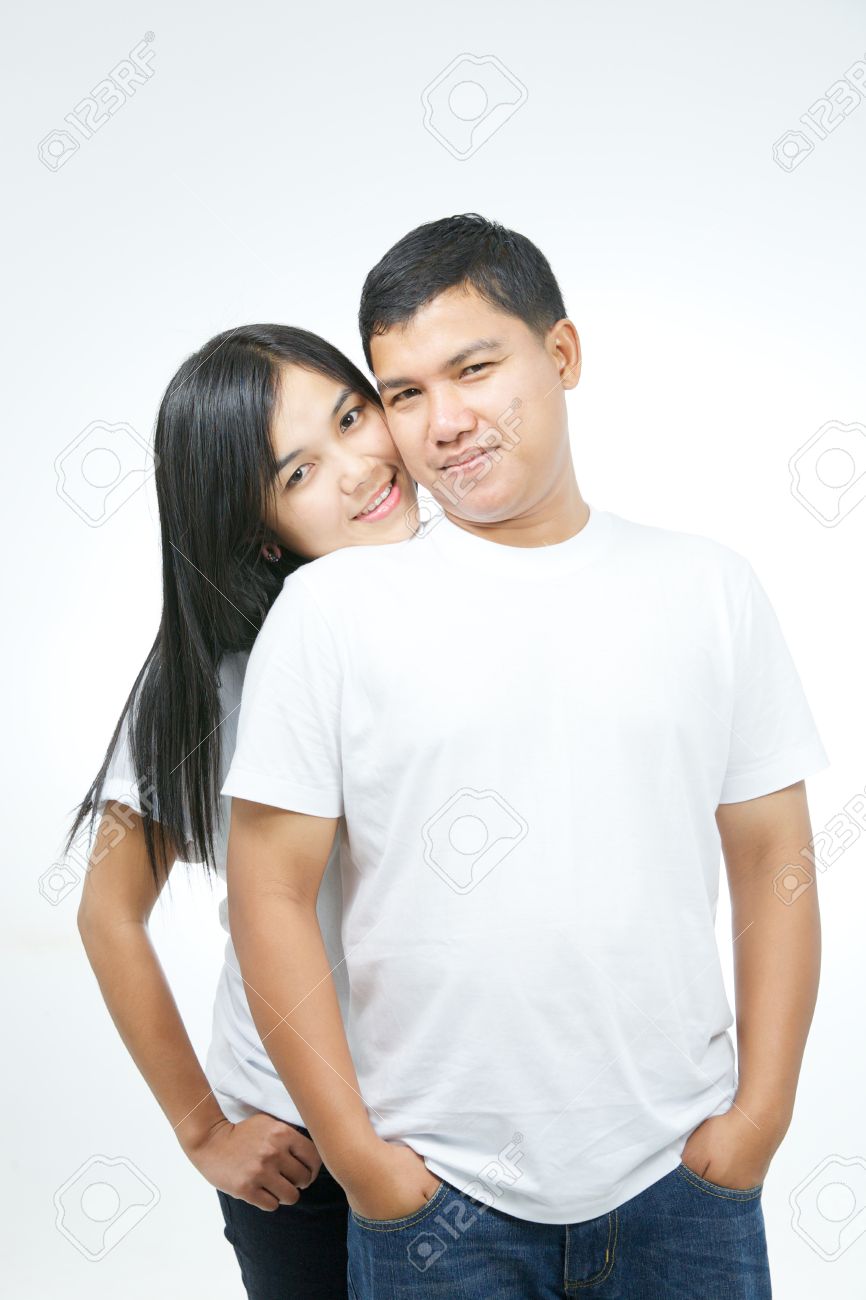 Happy Attractive Asian Couple In White T Shirt And Blue Jeans On White Background Stock Photo Picture And Royalty Free Image Image 17926884
